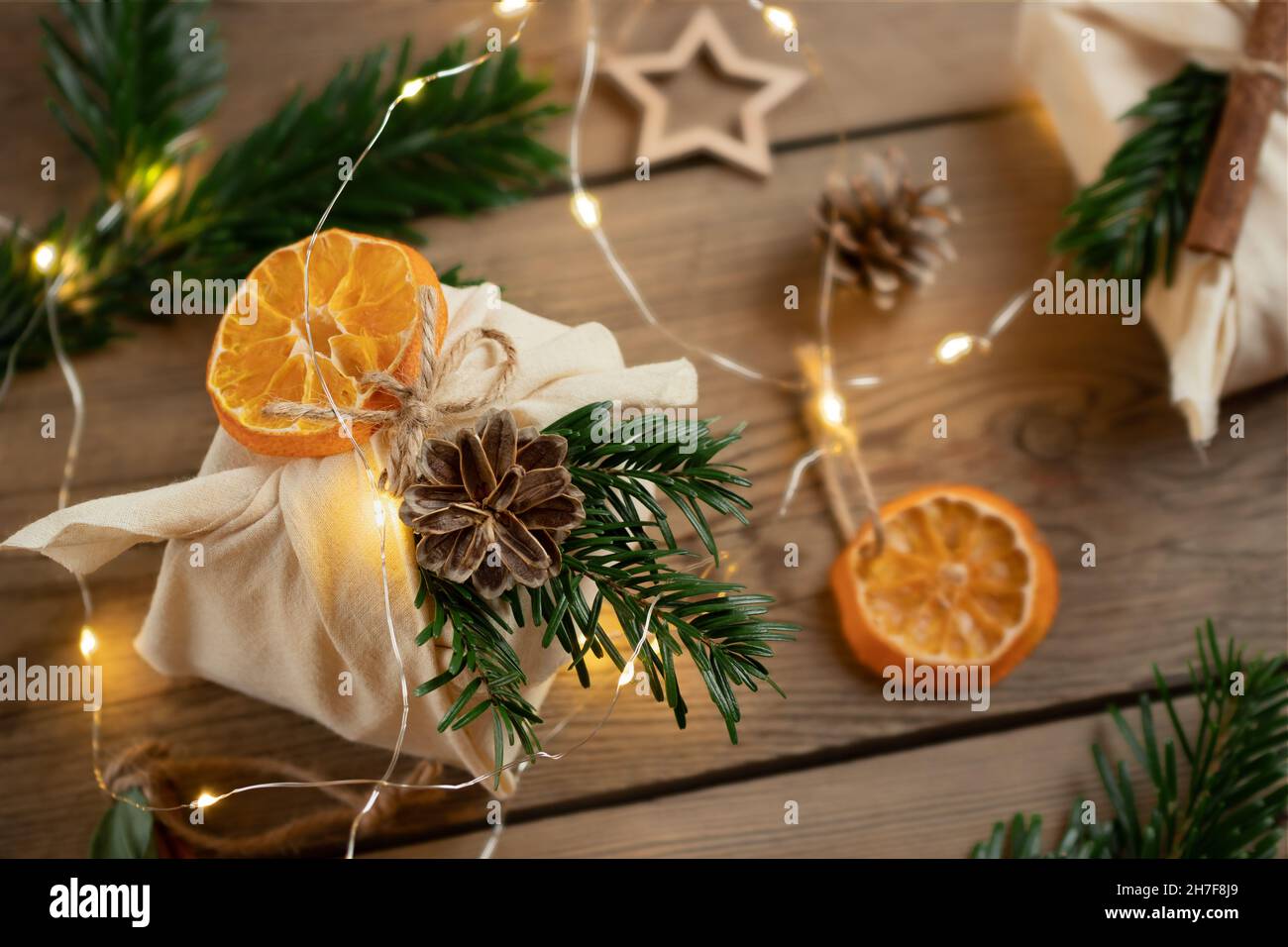 Image showcasing Zero waste christmas concept. Packed in natural fabric gifts and ...