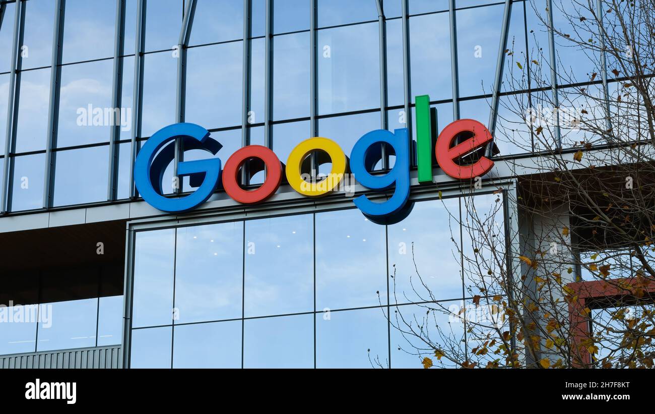 Seattle - November 21, 2021; Multi colored Google sign on a modern glass office building in the South Lake Union neighborhood of Seattle. Stock Photo