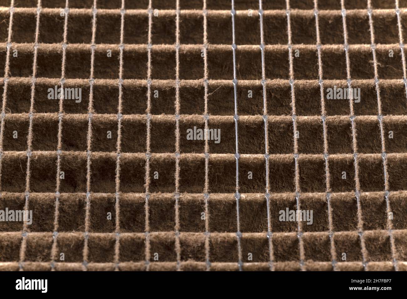 Close up of home air filter showing the dirt and particle cause