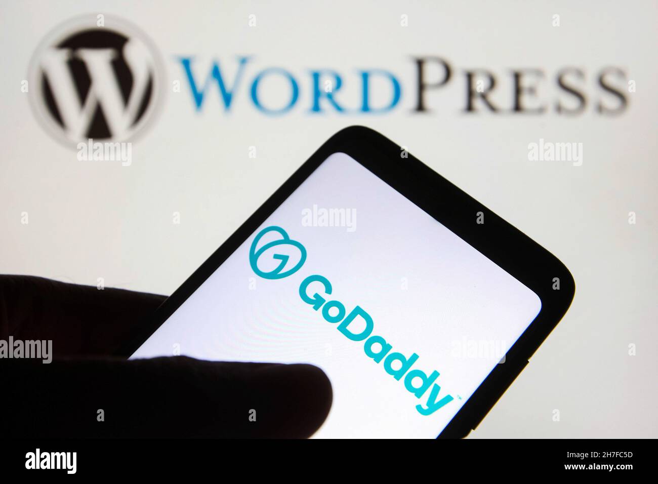 Ukraine. 22nd Nov, 2021. In this photo illustration, the GoDaddy Inc. logo is seen on a smartphone screen with the WordPress (WP, WordPress.org) logo in the background. Credit: SOPA Images Limited/Alamy Live News Stock Photo