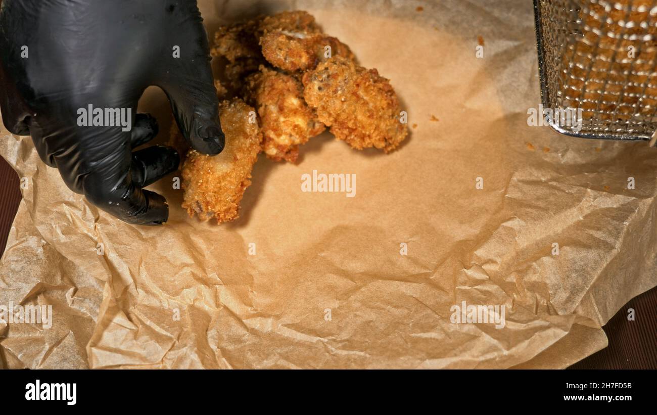 Cool beautiful fresh juicy cooked chicken wings in breading. Buffalo