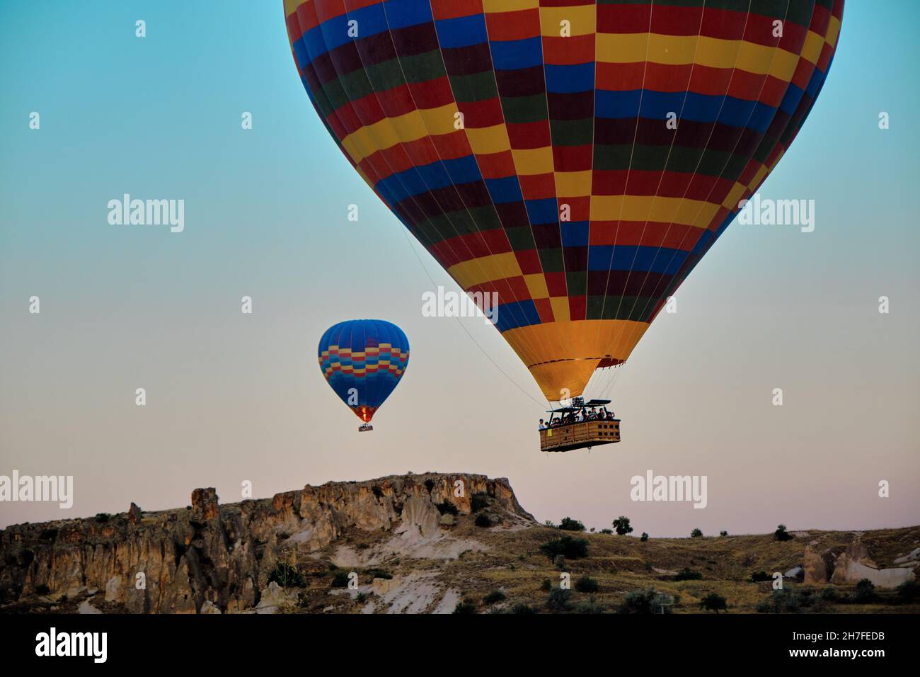 magnificent tourist center of Cappadocia - balloon flight, flying early in the morning just after sun rises by hot air balloons Stock Photo