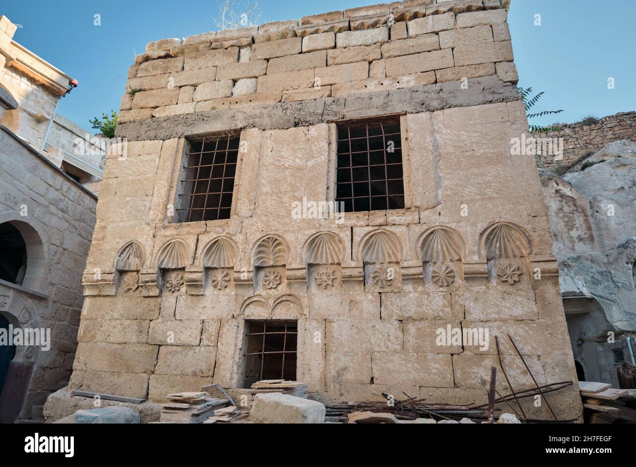 Brownfield and abandoned village house in cappadocia and made of limestone in Nevsehir goreme and beautiful engraving on wall of houses Stock Photo