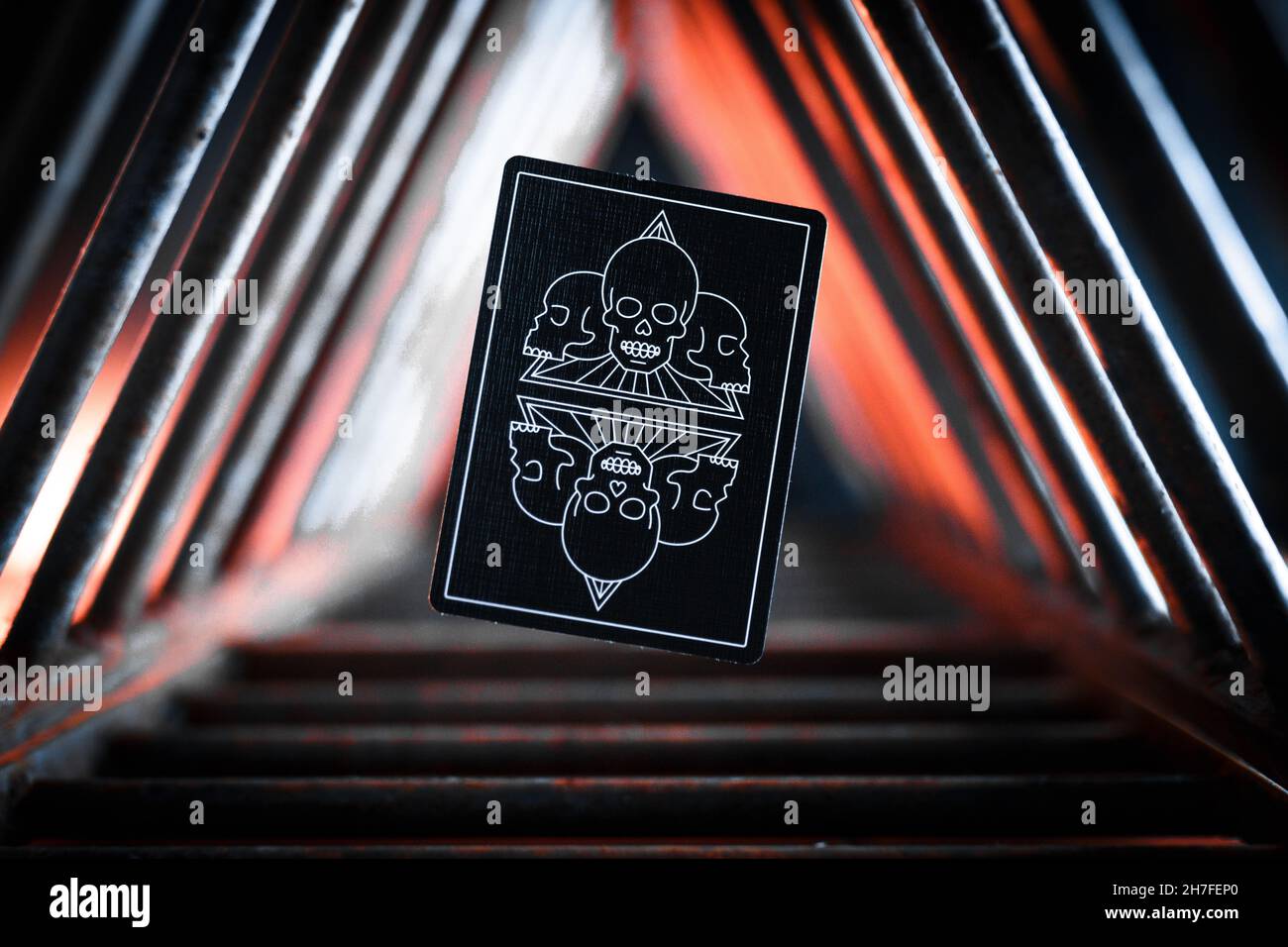 Closeup shot of a playing card with skulls Stock Photo