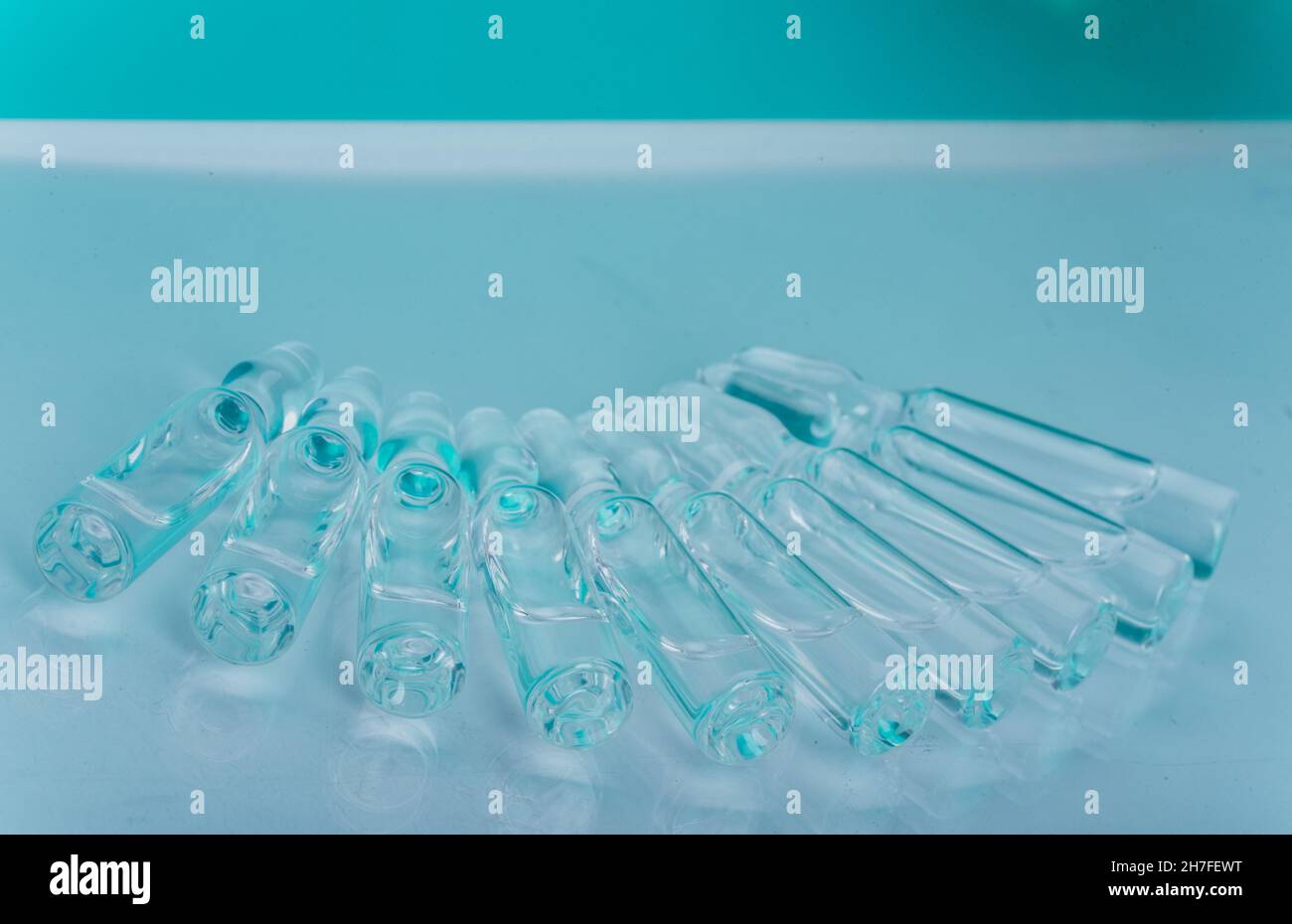 Glass medical ampoule vial for injection. Medicine is liquid sodium chloride with of aqueous