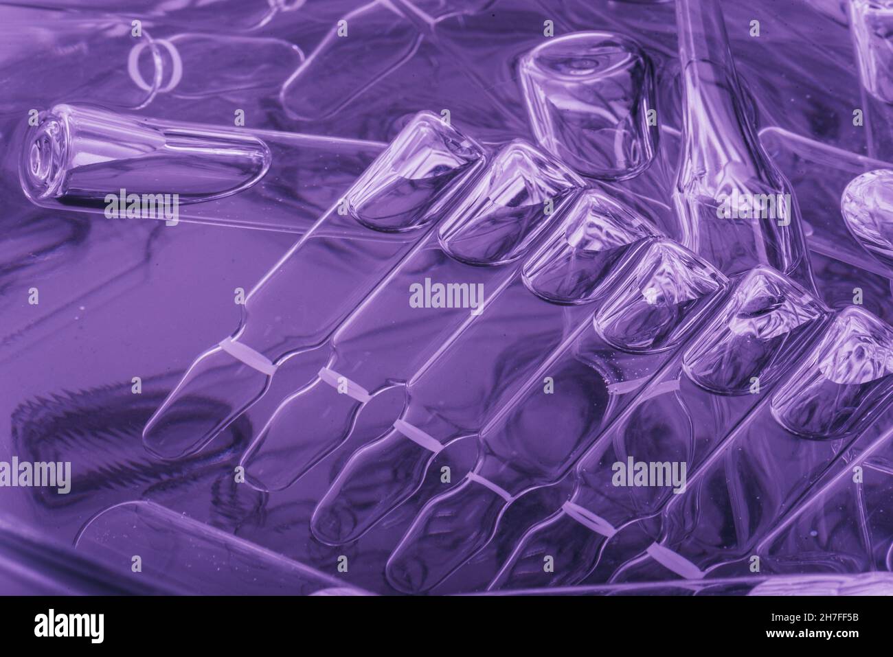 Glass medical ampoule vial for injection. Medicine is liquid sodium