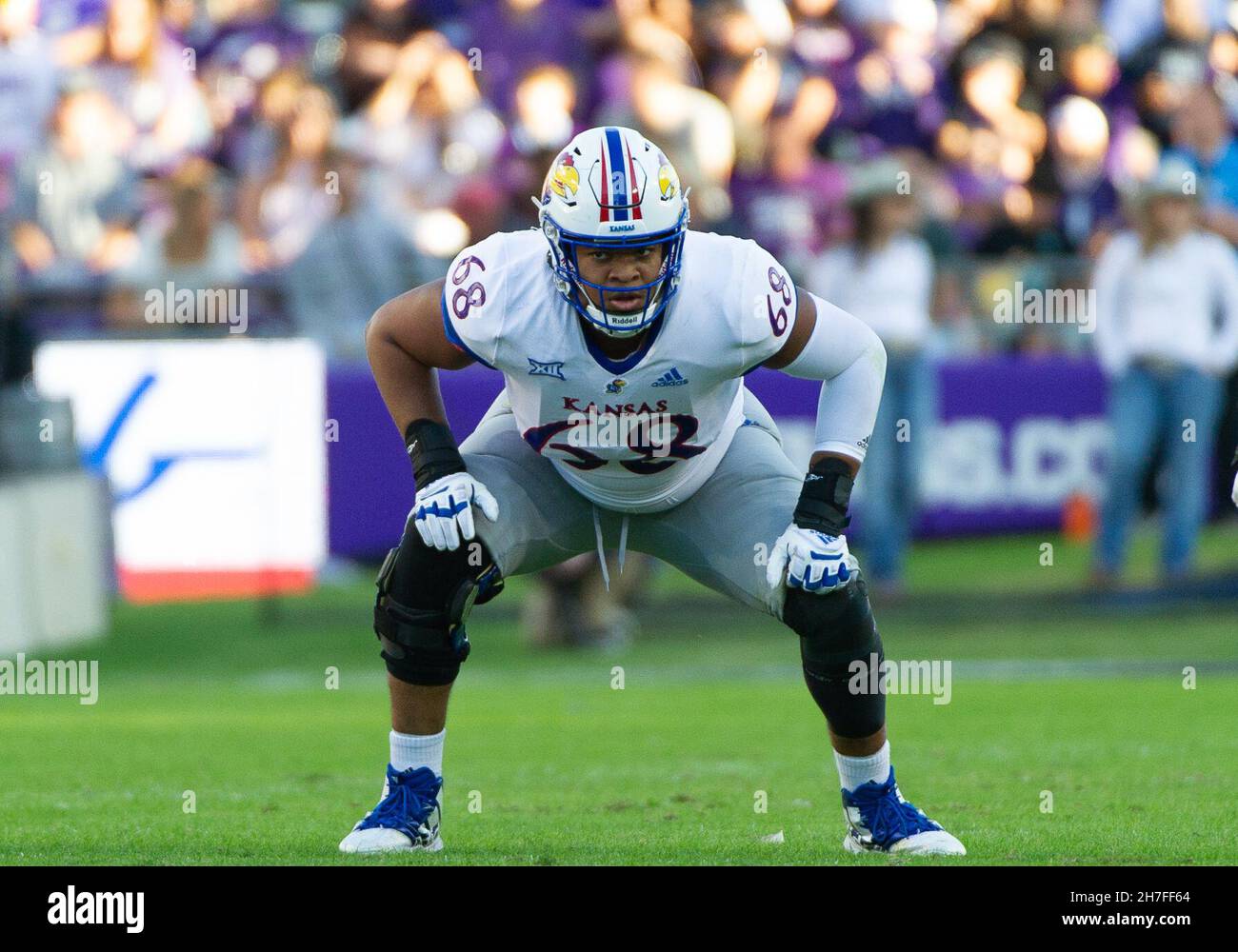 Fort Worth, Texas, USA. 20th Nov, 2021. Kansas Jayhawks offensive lineman Earl Bostick Jr. (68) gets ready for the snap during the 1st half the NCAA Football game between the Kansas Jayhawks and TCU Horned Frogs at Amon G. Carter Stadium in Fort Worth, Texas. Matthew Lynch/CSM/Alamy Live News Stock Photo