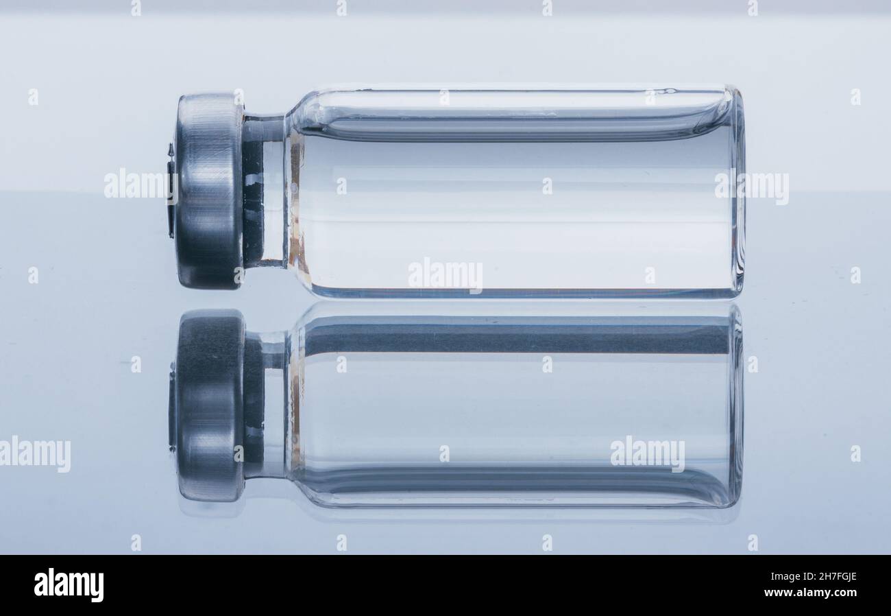 Glass medical ampoule vial for injection. Medicine is dry white drug ...