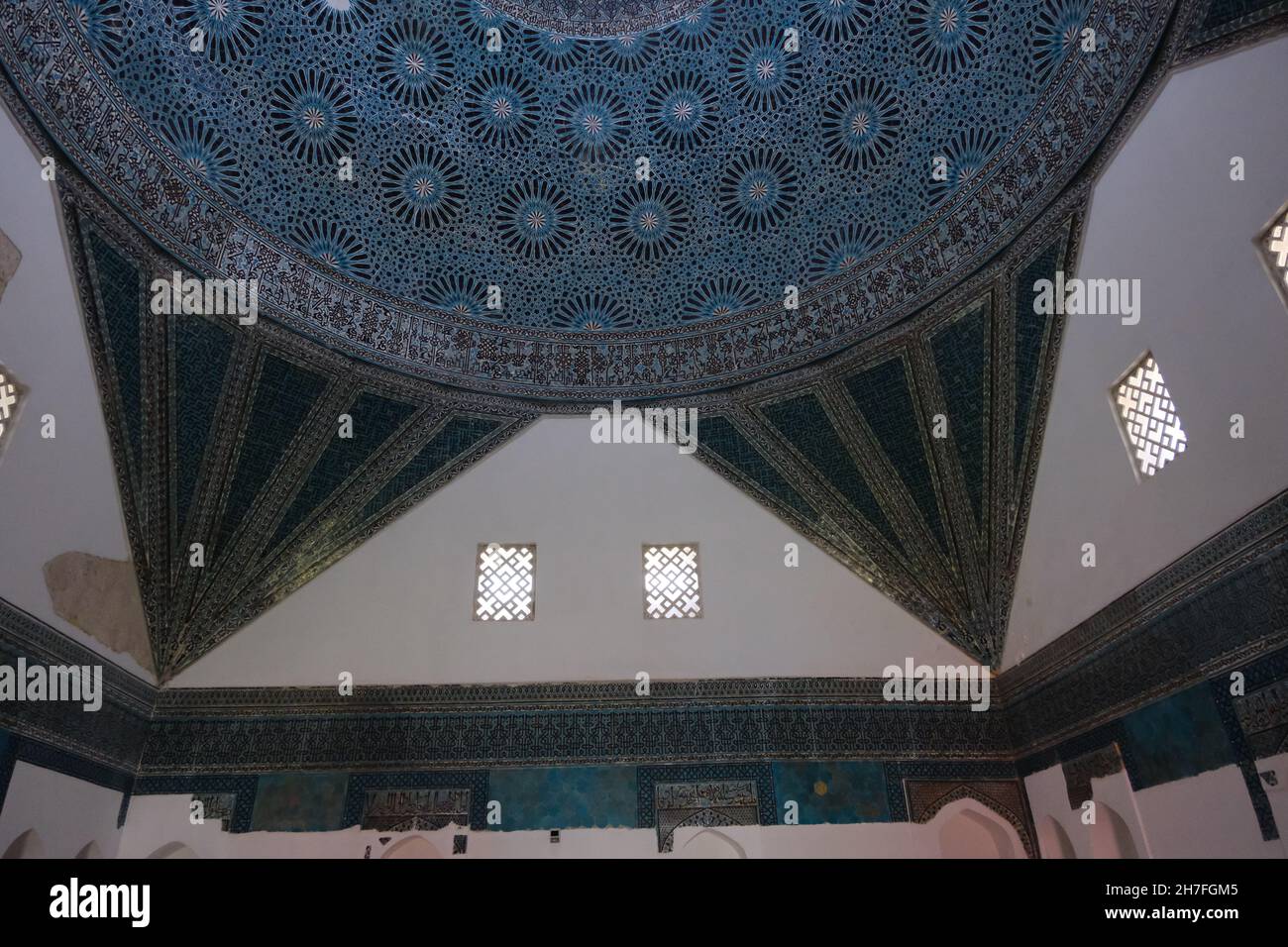 inside the Karatay Madrasa in Konya. Magnificent dome and light coming from top of windows and some of tiles are missing Stock Photo