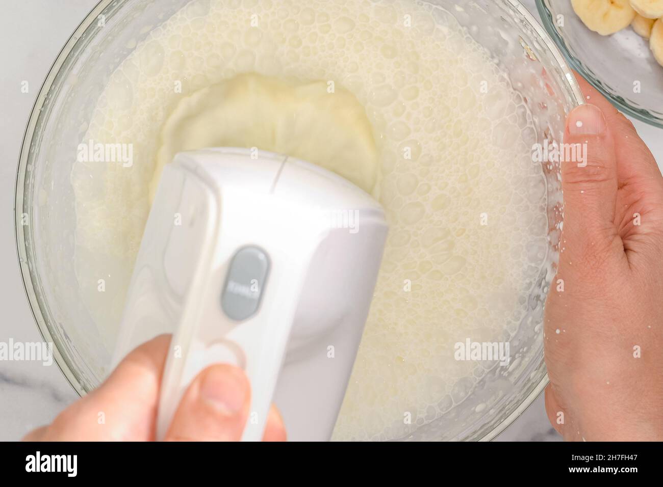 Whipped cream cheese desert recipe. Mixing ingredients in a glass bowl
