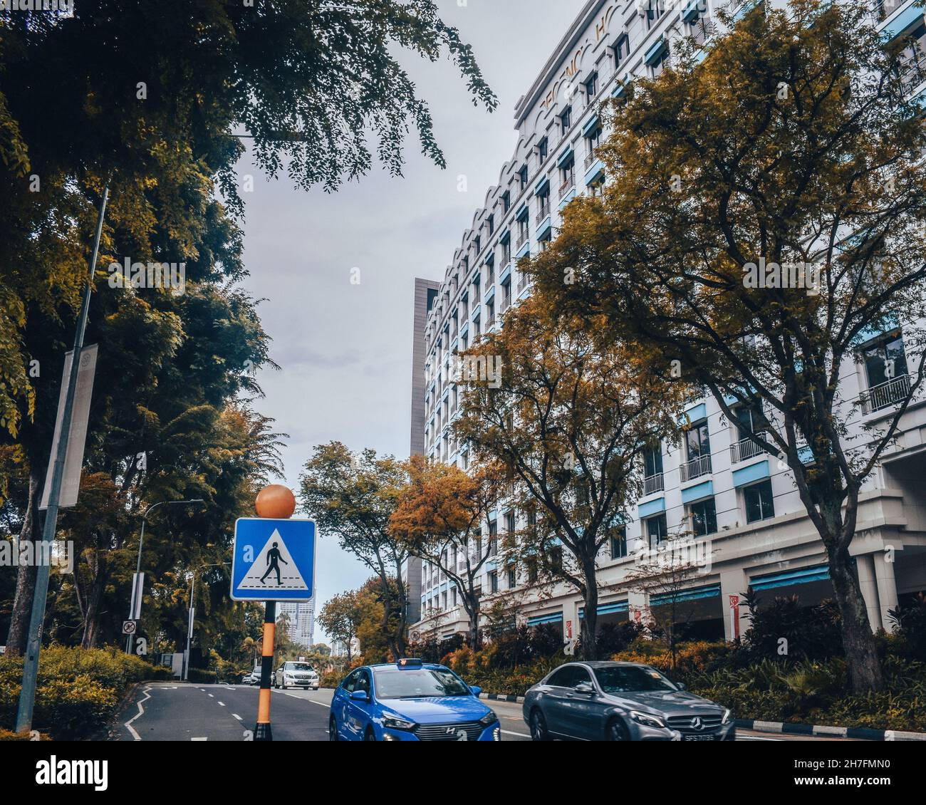 DHOBY GHAUT, SINGAPORE - Aug 28, 2021: The streets of Singapore with tall business buildings in autumn Stock Photo