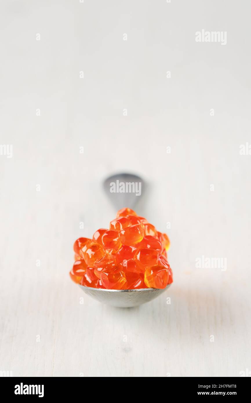 Spoon with salmon red caviar (photo with shallow depth of field) Stock Photo