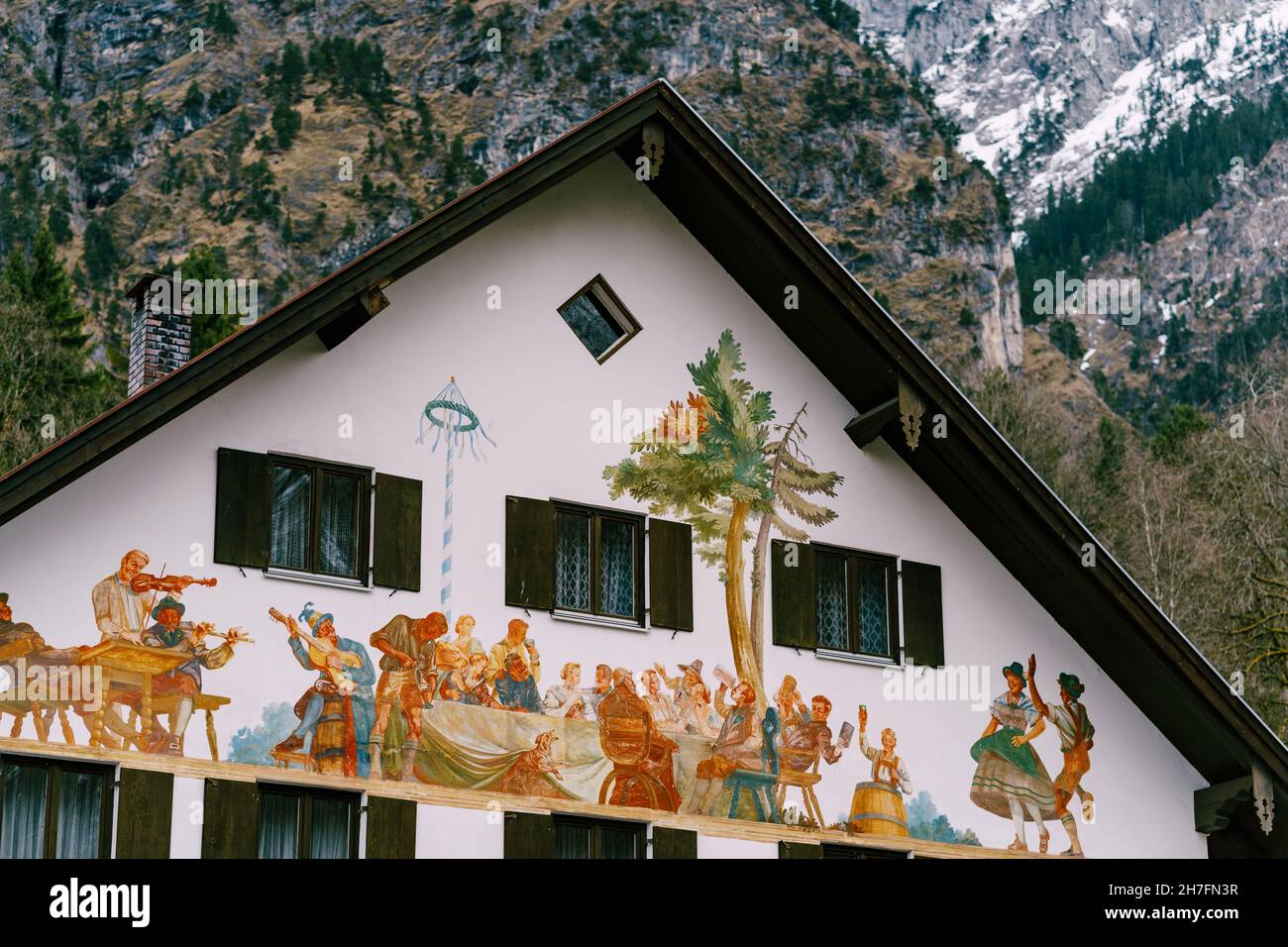 painted-facade-of-a-house-in-the-background-of-mountains-in-the-village