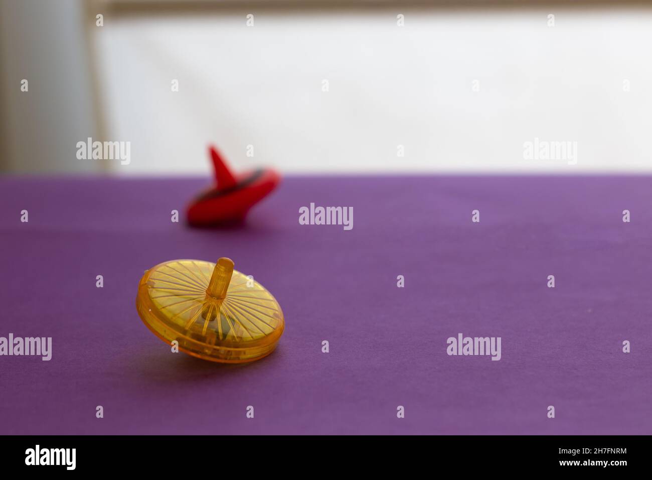 Colorful plastic spinning tops, of the Jewish Hanukkah holiday, made of