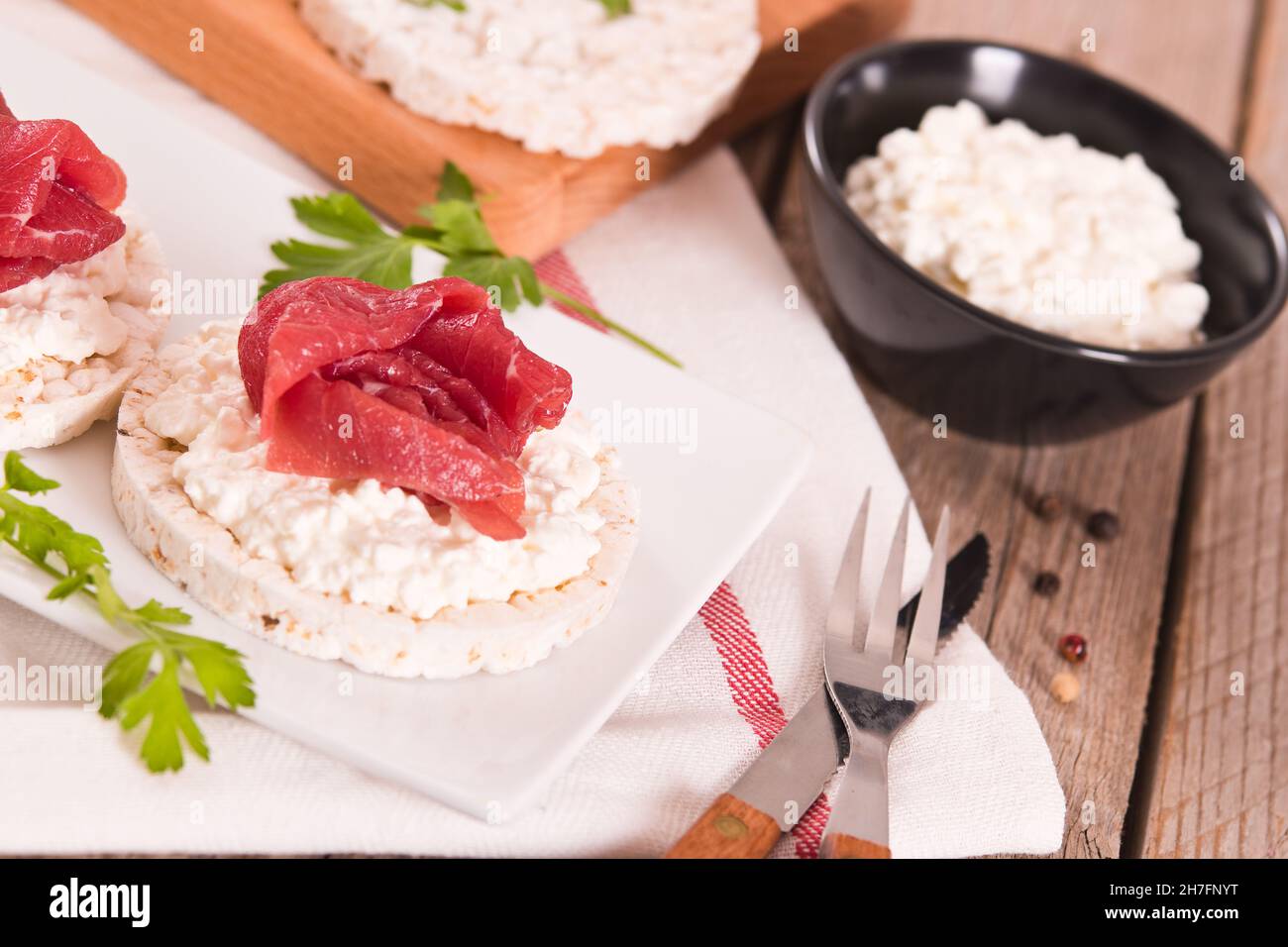 Rice cakes with milk flakes and cold beef Stock Photo - Alamy