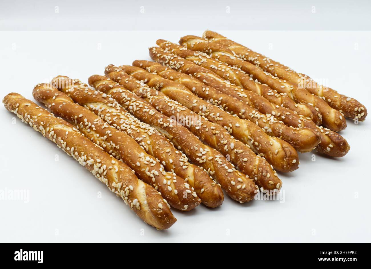 Bread stick with sesame seeds isolated on white background Stock Photo