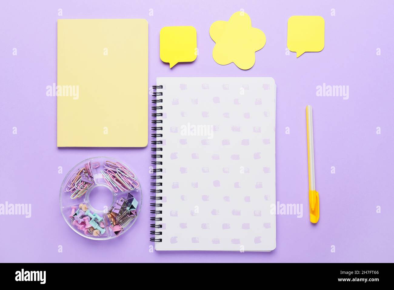 Set of stationery with sticky note papers on lilac background Stock Photo