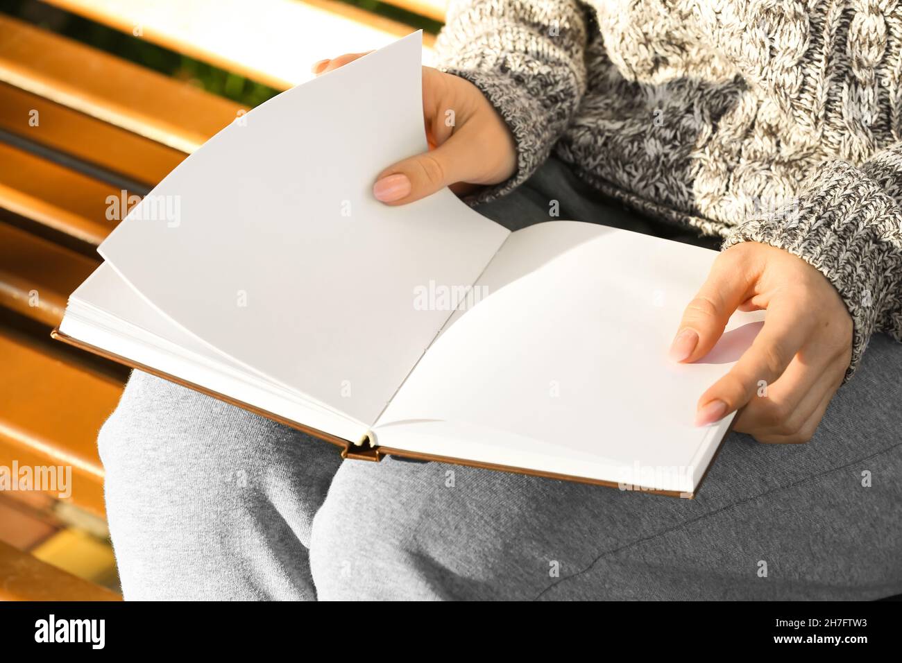 Woman holding book with blank pages · Free Stock Photo