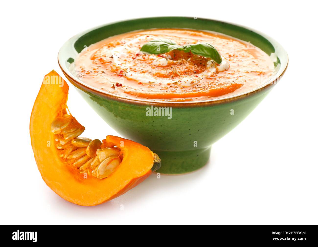 Bowl with delicious pumpkin cream soup on white background Stock Photo ...