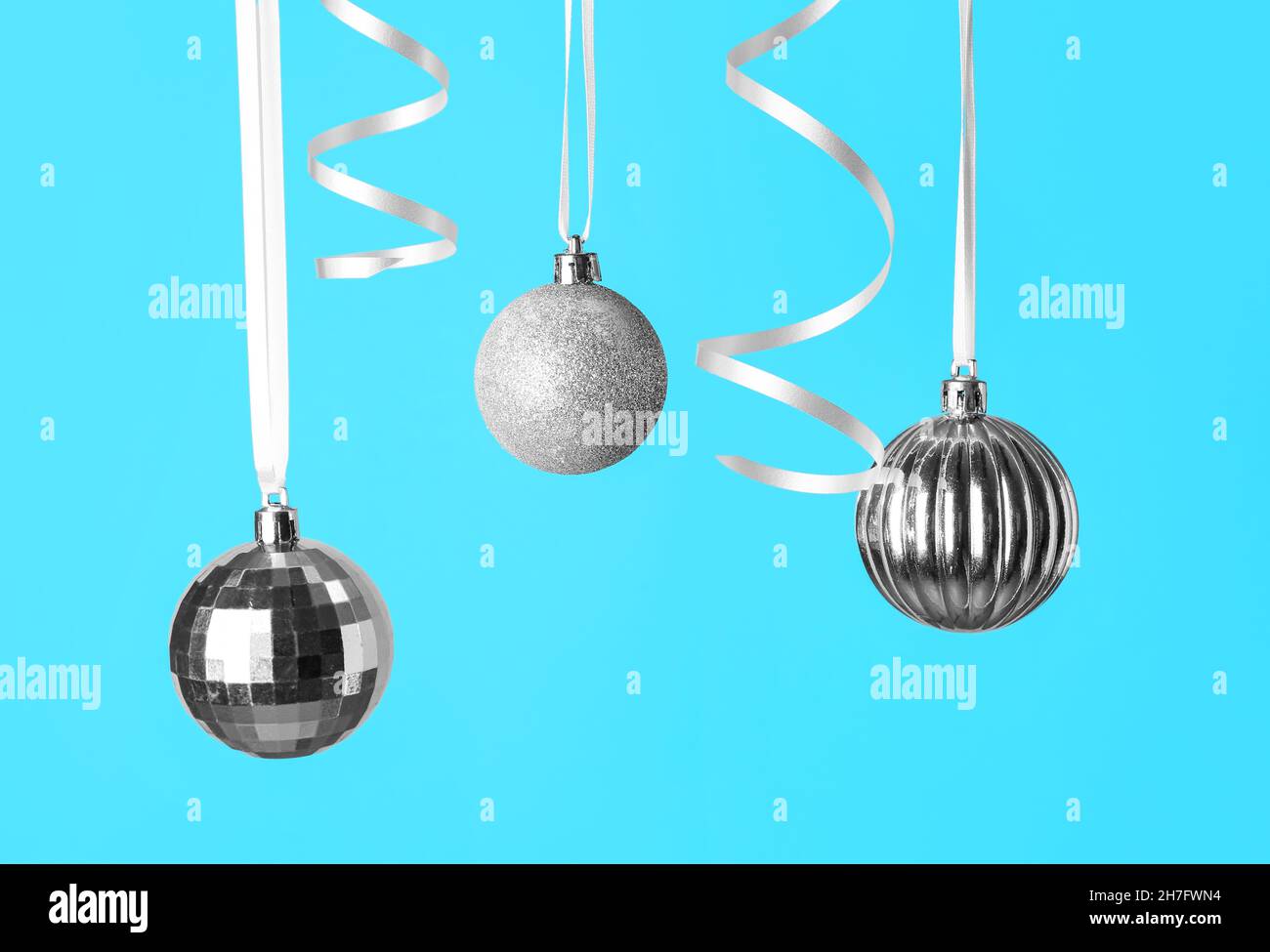 Christmas tree baubles turquoise silver hi-res stock photography and ...