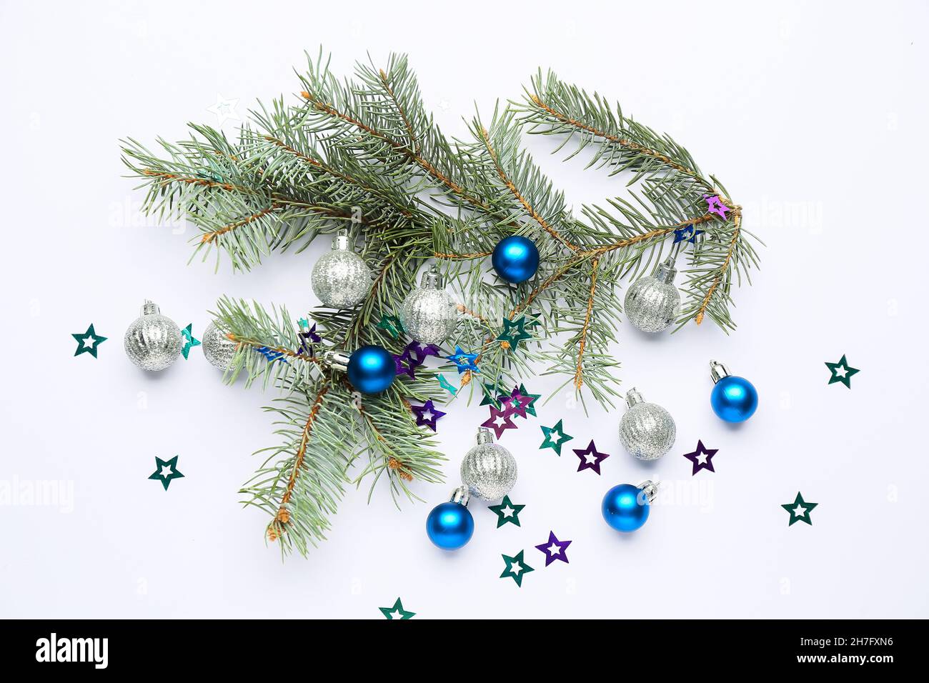 Fir tree branches with beautiful Christmas decor on white background ...