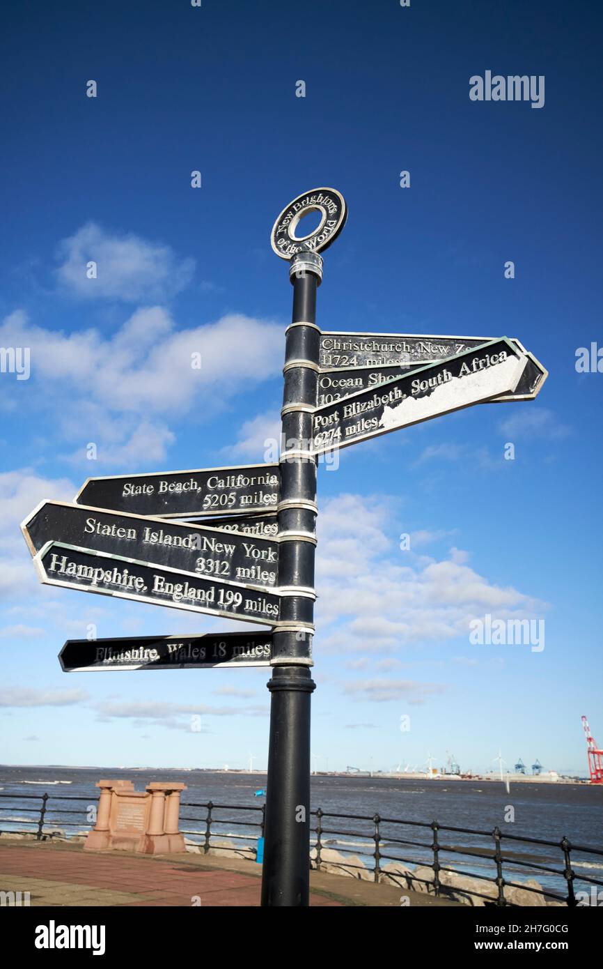 direction signs and distances to new brightons around the world New Brighton the Wirral merseyside uk Stock Photo