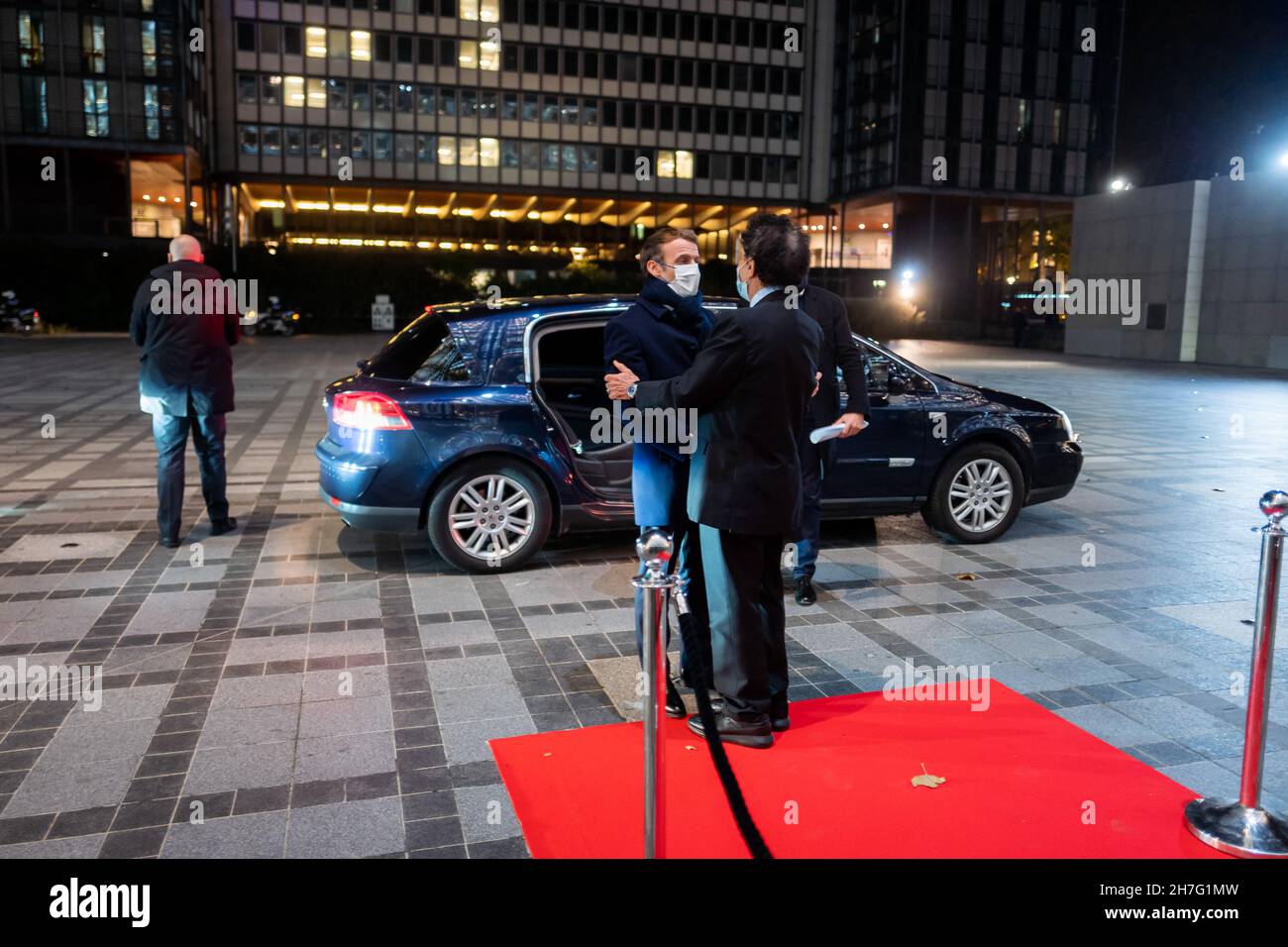 Jack Lang greets President Emmanuel Macron as he arrives to visit the