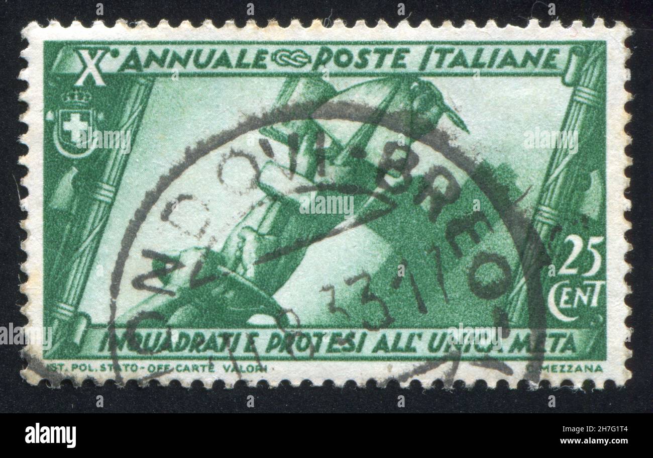 ITALY - CIRCA 1932: stamp printed by Italy, shows Hands of workers and tools, circa 1932 Stock Photo