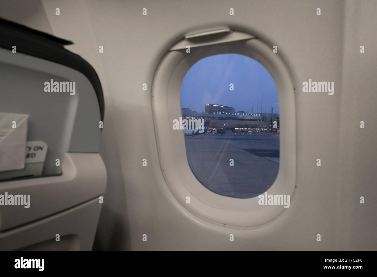 Aircraft window with Arlanda Airport. Stock Photo