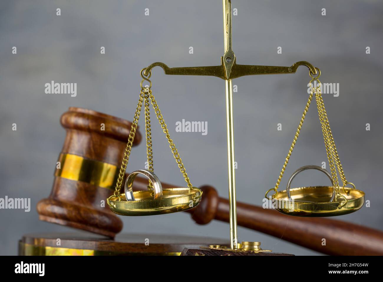 Divorce Concept, Judge's gavel with justice scales and rings Stock Photo