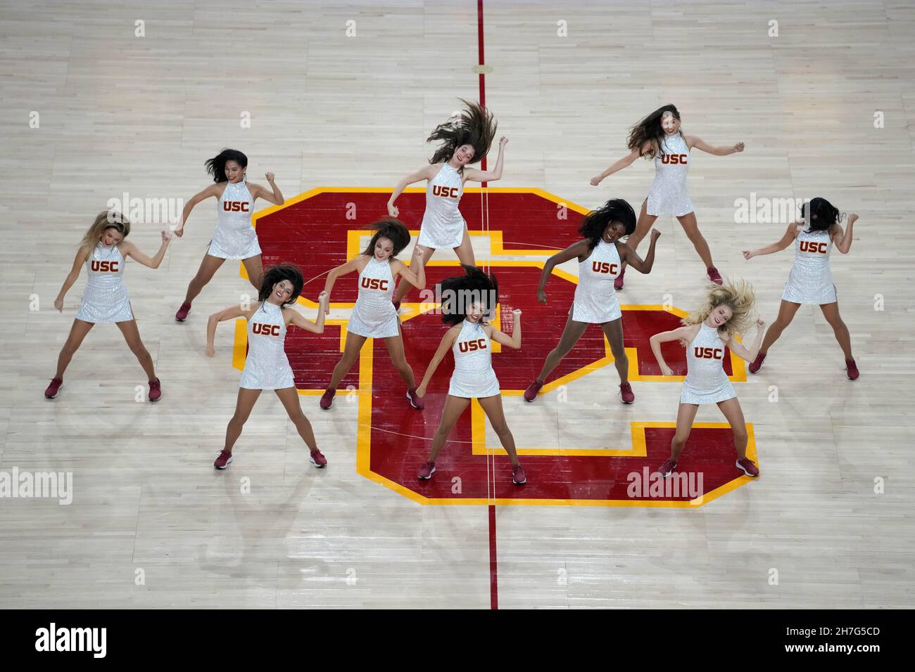 Southern California Trojans song girls cheerleaders perform on the SC logo during an NCAA college basketball game against the Dixie State Trailblazers Stock Photo