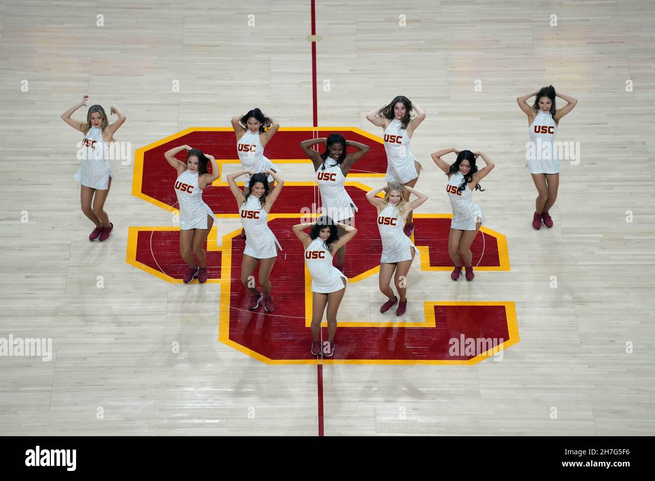 Southern California Trojans song girls cheerleaders perform on the SC logo during an NCAA college basketball game against the Dixie State Trailblazers Stock Photo