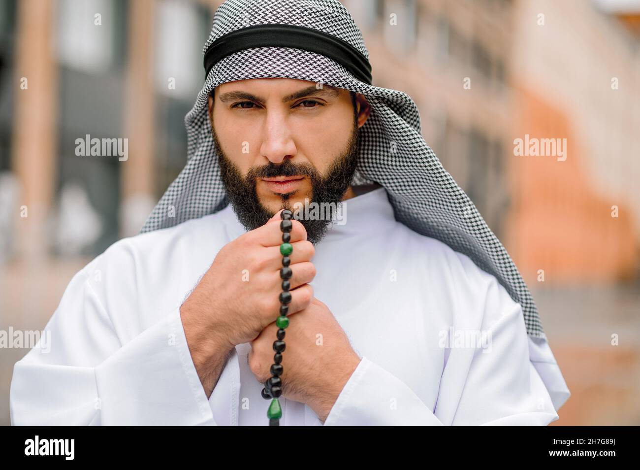 Bearded arabian guy in traditional 