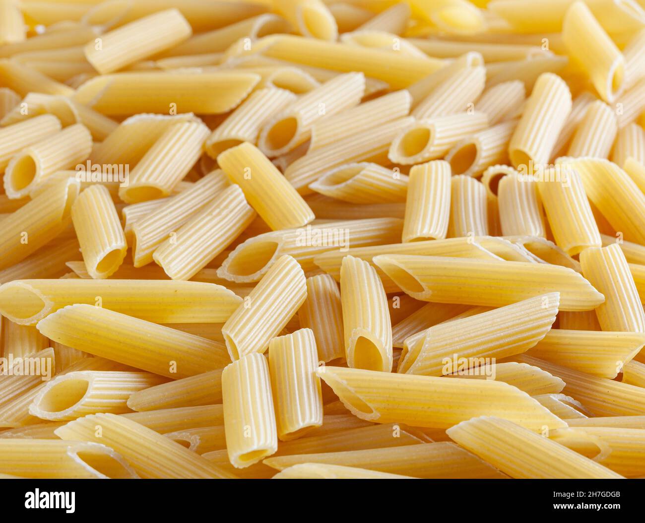 Raw pasta penne texture background hires stock photography and images