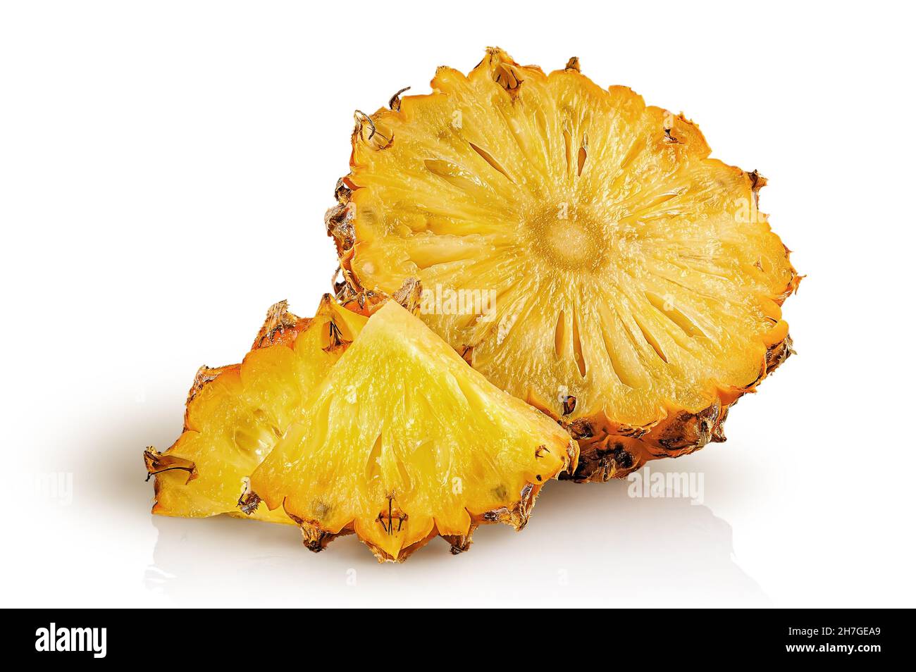Half pineapple and slices isolated on white background Stock Photo