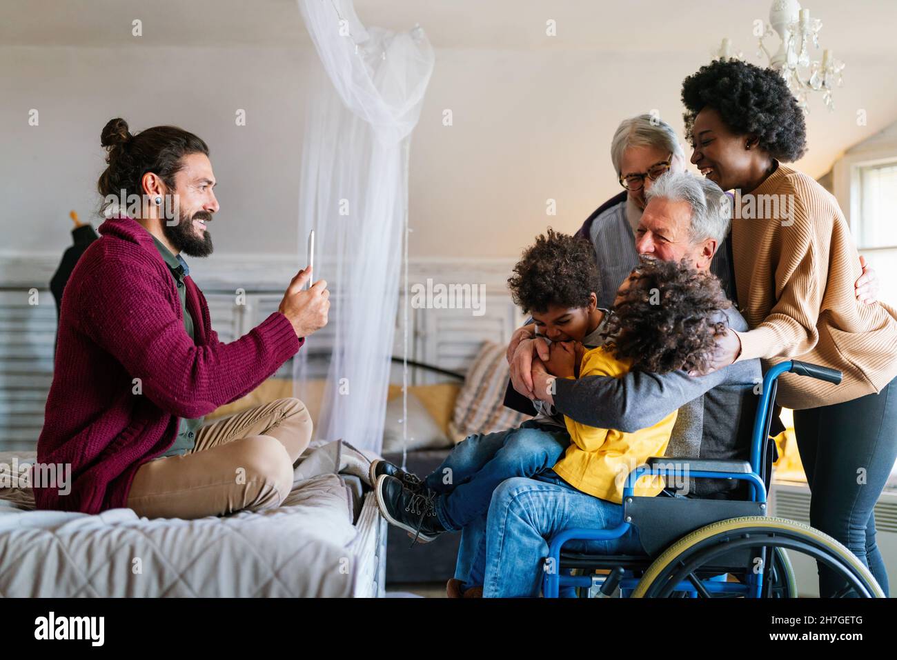 Three generation happy multiethnic family group at home Stock Photo