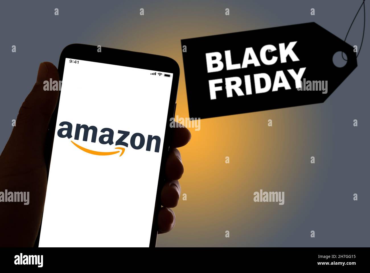 The Amazon shopping app logo is seen on the display of a smarthphone with a  "Black Friday" sign in the background in Barcelona, Spain on November 19  Stock Photo - Alamy
