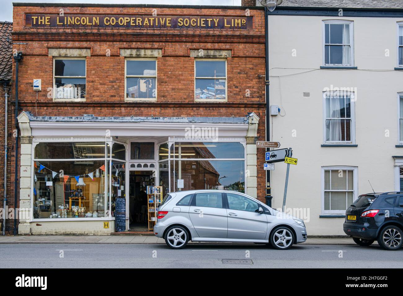The former Lincoln Co Operative Society building in Horncastle which is now a shop selling second-hand goods and antiques, Lincolnshire, England Stock Photo