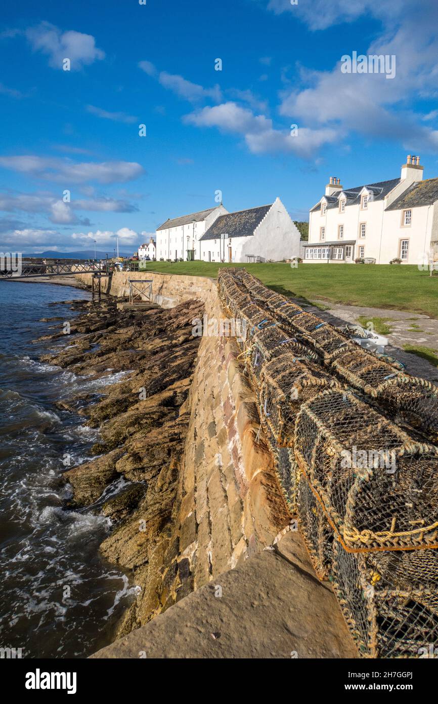 UK, Scotland,  Easter Ross, Ross and Cromarty. Portmahomack fishing village on the Tarbat peninsula. Creel pots lined up by the sea (Moray Firth). Stock Photo