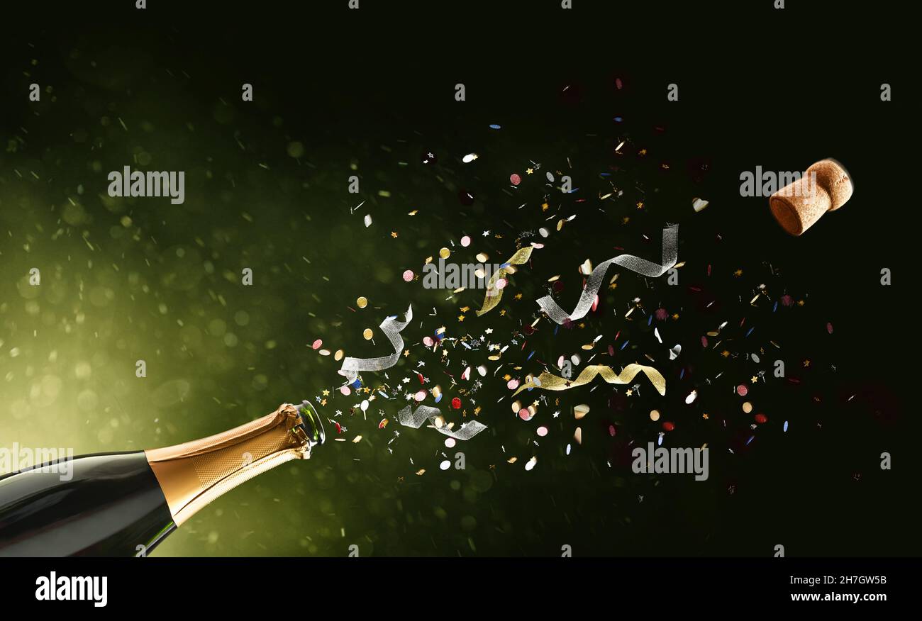 Festive concept with freshly opened bottle of sparkling wine with