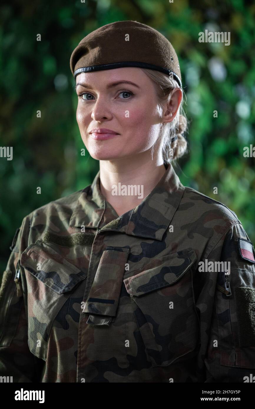 Portrait of a young lady soldier in military clothing while on duty