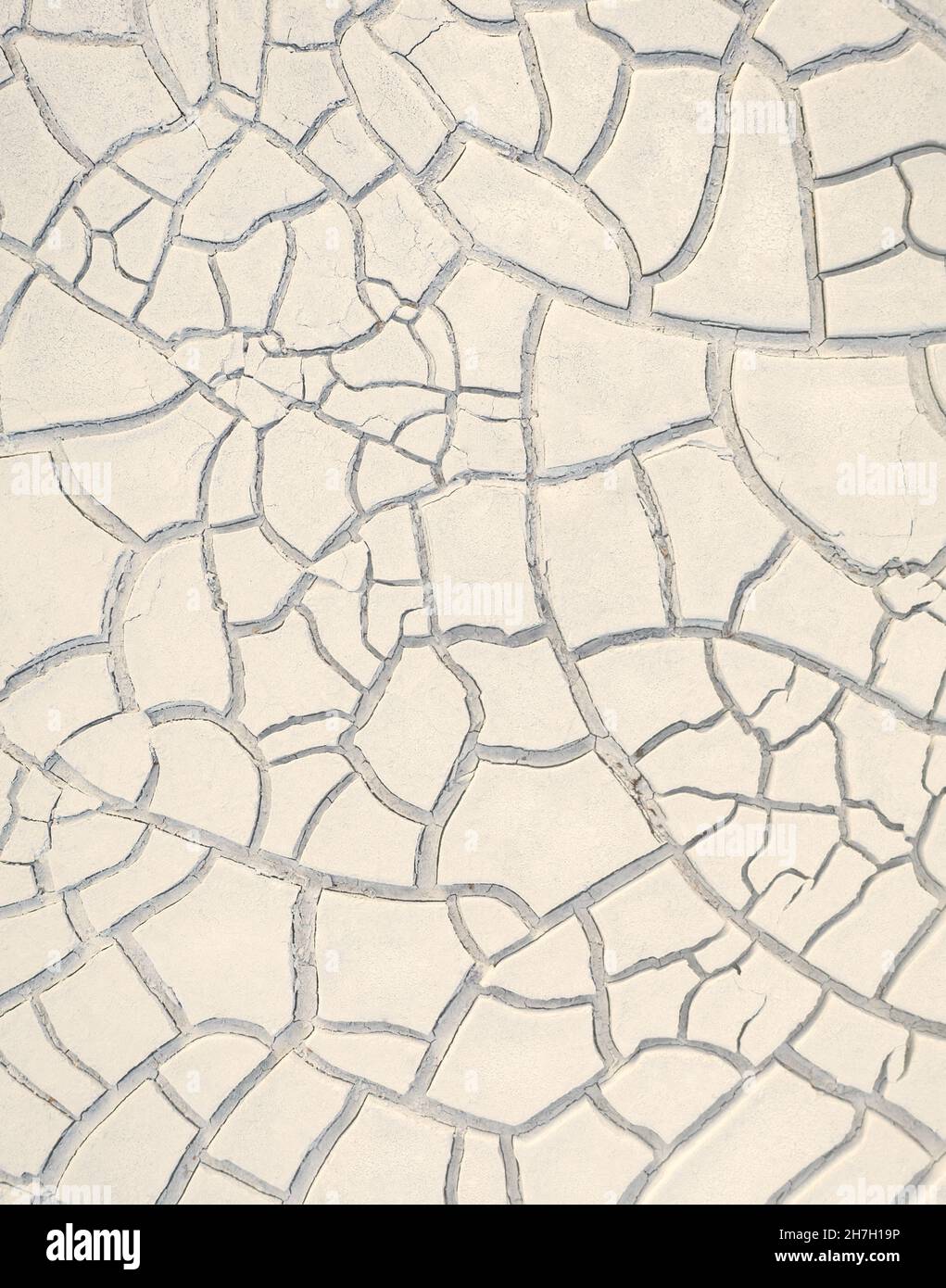 Cracked white clay on dried lakebed, natural beige pattern Stock Photo