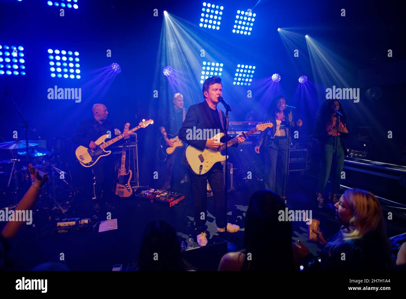 Rick Astley performing at Manchester Airport's Concorde Conference Centre during a charity event supporting Maggie's Manchester Cancer Support Centre. Stock Photo