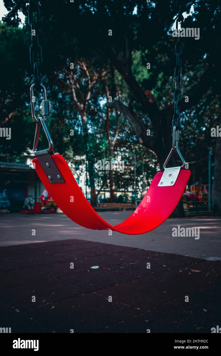 Vertical shot red swing hi-res stock photography and images - Alamy