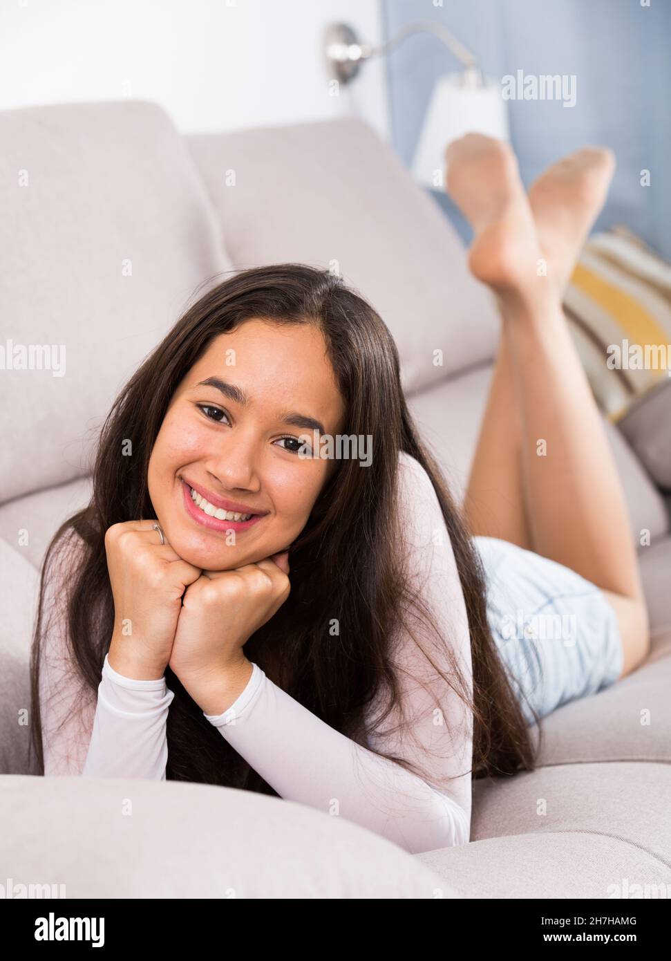 female resting and dreaming on sofa Stock Photo Alamy