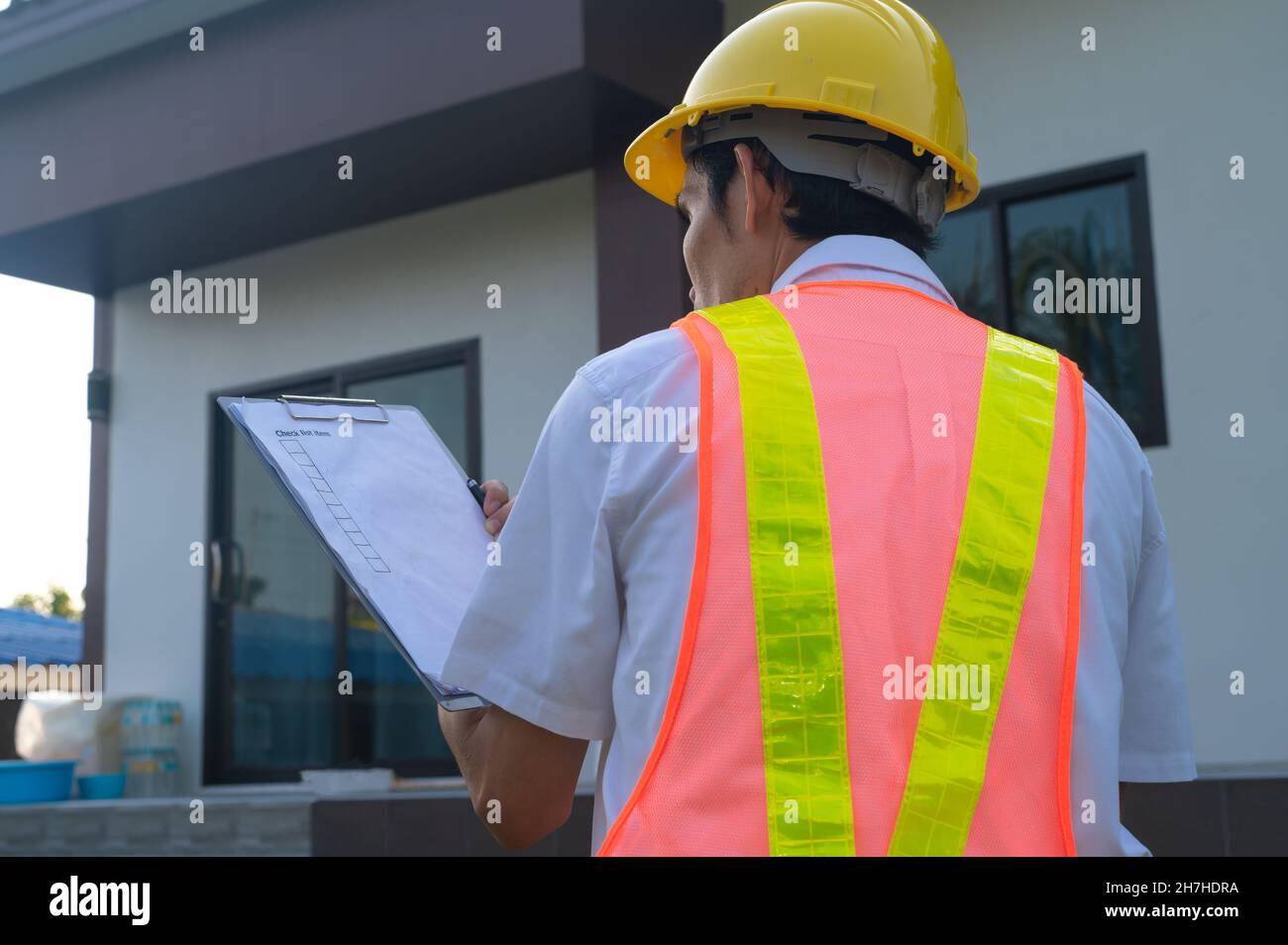 Engineer Auditor checking home building construction Stock Photo - Alamy