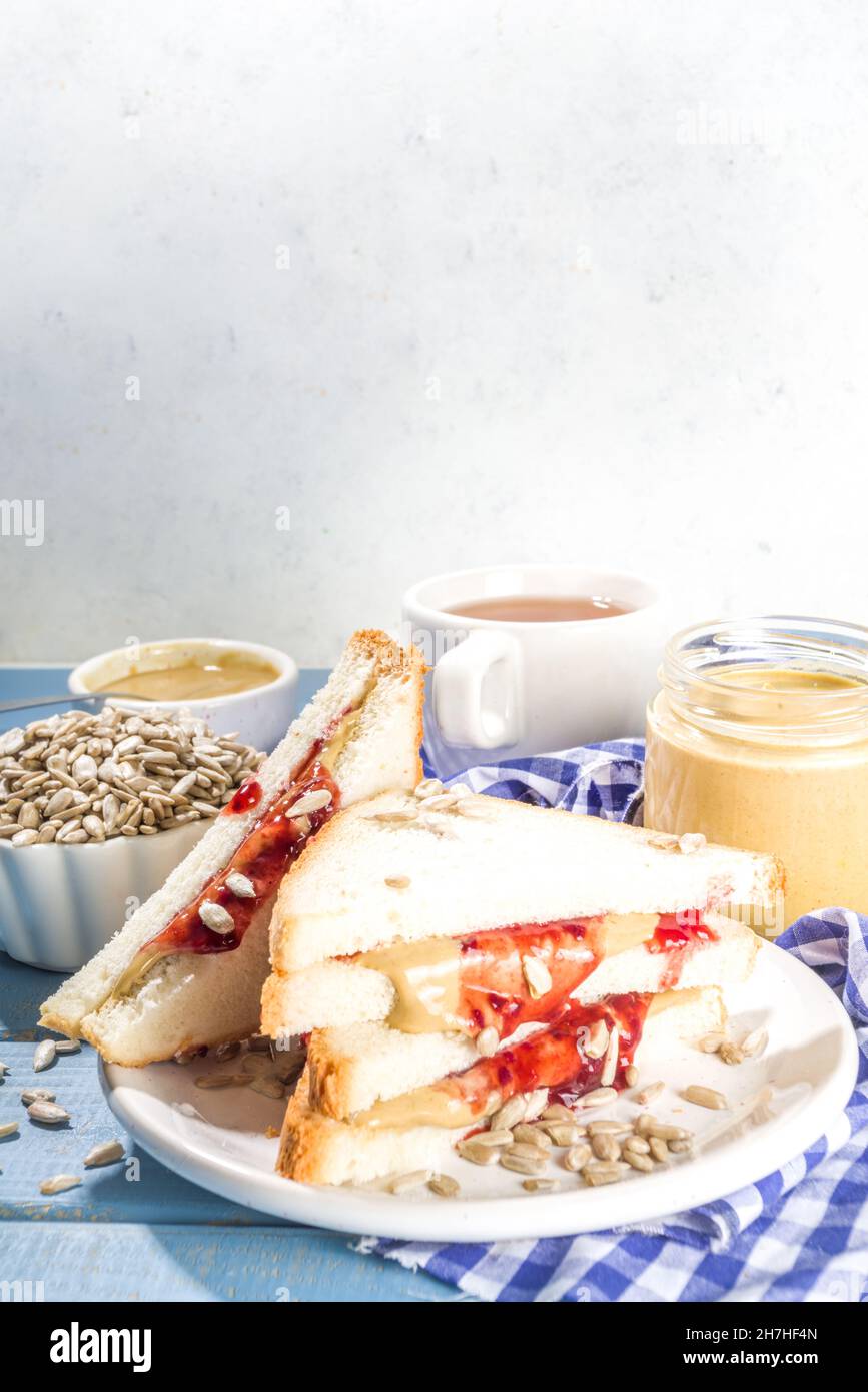 Traditional American breakfast sandwich toast with alternative not nut butter sunflower seeds