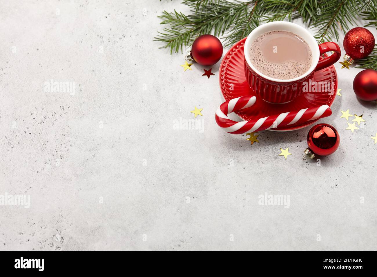 Red cup of hot chocolate drink and christmas decorations Stock Photo