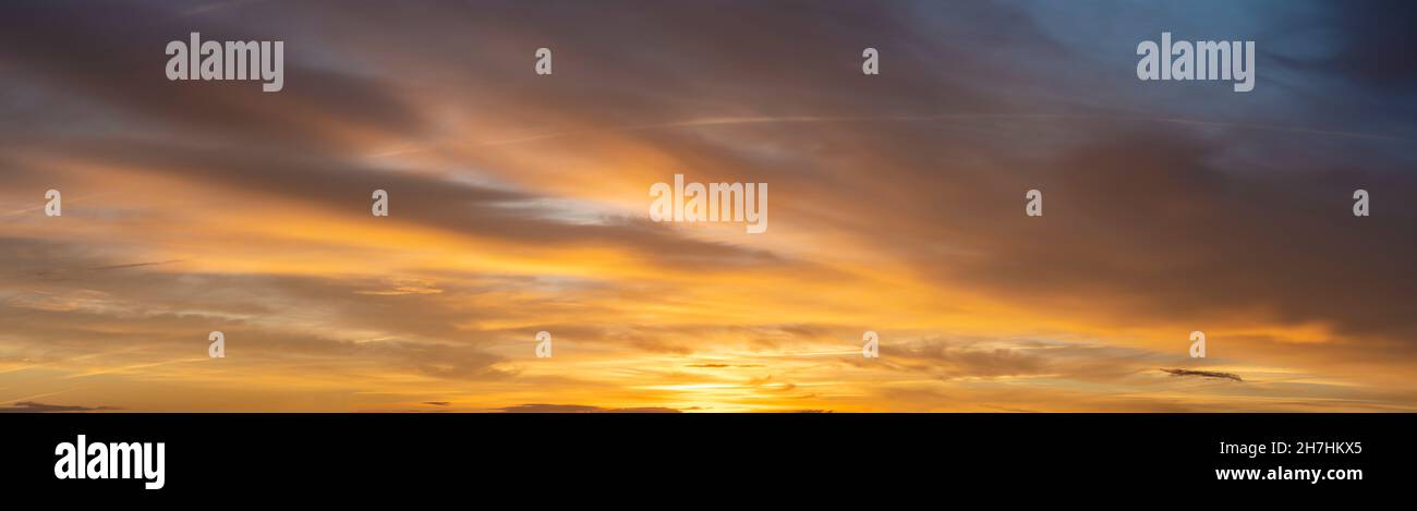 Fiery sunset, colorful clouds in the sky Stock Photo