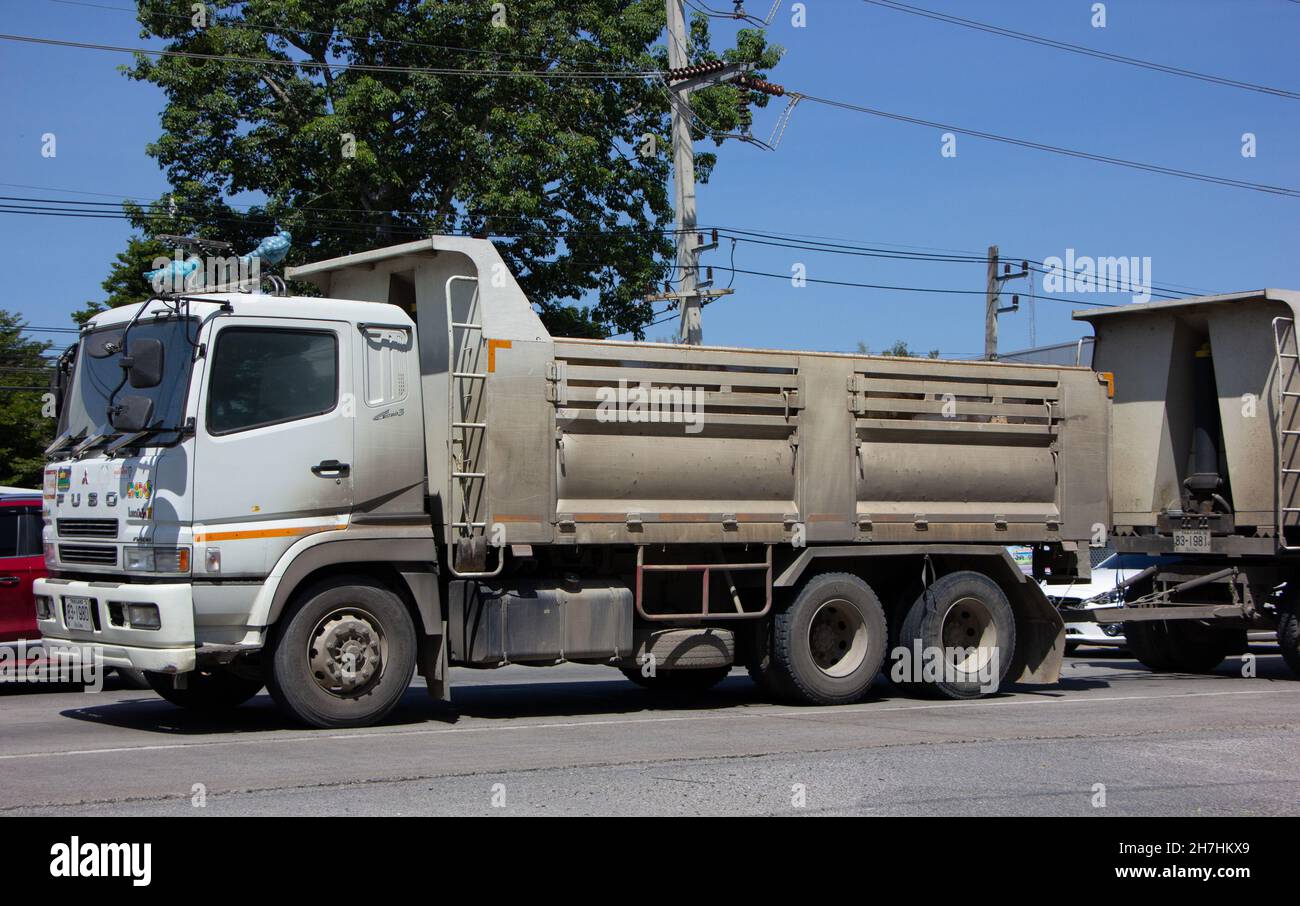 Chiangmai, Thailand - October  6 2021: Private Mitsubishi Fuso  Dump Truck.  Photo at road no.121 about 8 km from downtown Chiangmai, thailand. Stock Photo